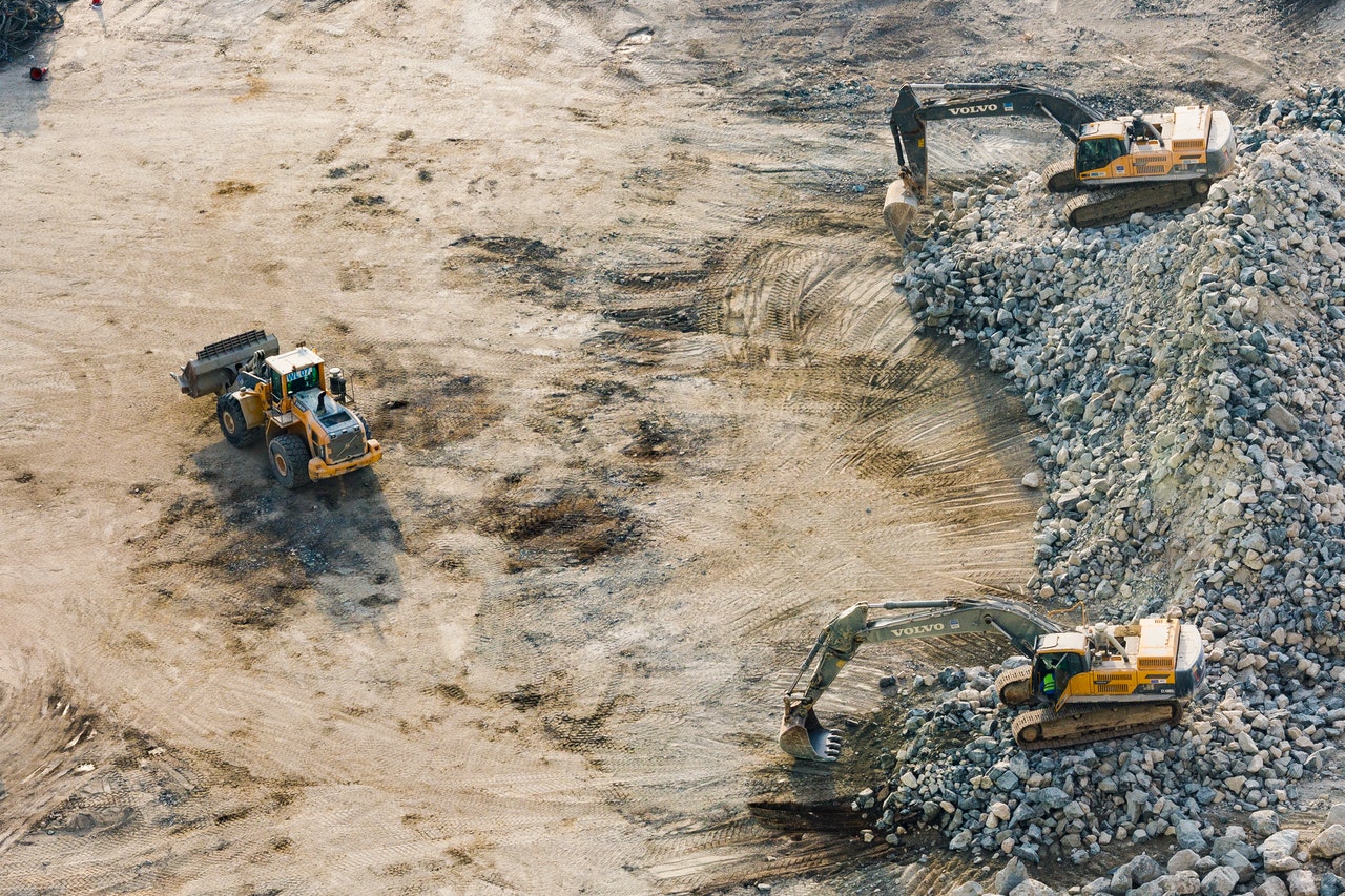 three yellow excavators near front end loader 1238864 1